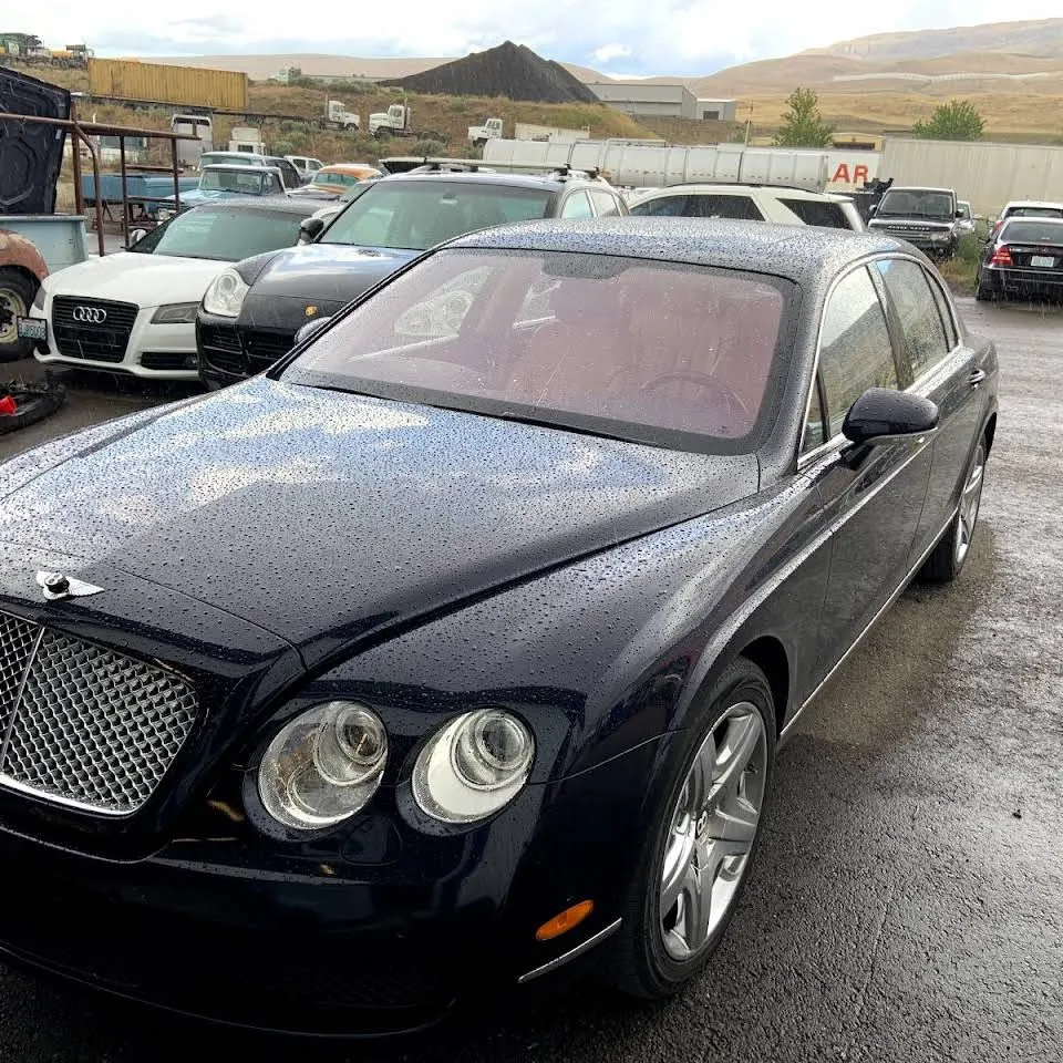A Bentley Flying Spur on the wet lot at Erik's.